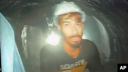 This screen grab image provided by the Uttarakhand State Disaster Response Force (SDRF) shows one of the 40 workers trapped inside a collapsed tunnel in Silkyara, in the northern Indian Uttarakhand state, India, Nov. 21, 2023. 