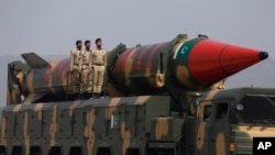 FILE - Pakistani military personnel stand beside a surface-to-surface ballistic missile during a Pakistan Day military parade in Islamabad on March 23, 2019. A White House official said on Dec. 19, 2024, that Pakistan is developing missile capabilities that could reach the U.S.