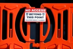 A barricade is seen at the top of the steps leading to the front entrance of the Pennsylvania Capitol, Jan. 16, 2021, in Harrisburg. At capitols across the country, National Guard troops are being called up, fences built, and barricades positioned.