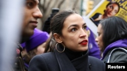 FILE - Rep. Alexandria Ocasio-Cortez (D-NY) speaks during a march organized by the Women's March Alliance in the Manhattan borough of New York City, Jan. 19, 2019. 