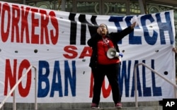 FILE - Tech workers protest Trump administration policies in San Francisco, California, Feb. 13, 2017.