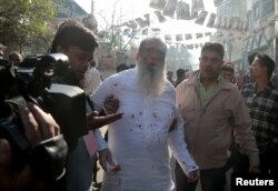 Salahuddin Ahmed, a Bangladesh Nationalist Party (BNP) candidate for general election, is seen bleeding as he was stabbed on a election day in Dhaka, Dec. 30, 2018.