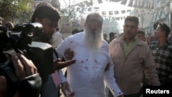 Salahuddin Ahmed, a Bangladesh Nationalist Party (BNP) candidate for general election, is seen bleeding as he was stabbed on a election day in Dhaka, Dec. 30, 2018.