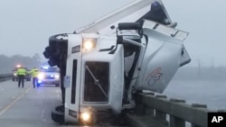 Tropical Weather-Hermine: In this photo provided by Tyrrell County Sheriff’s office shows a tipped over 18-wheeler in Columbia, N.C., on Saturday, Sept. 3, 2016. 