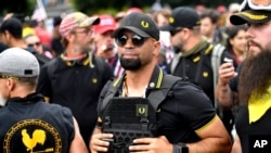 Arhiva - Enrike Tarija tokom okupljanja ultradesničarske grupe Praud bojs 2019. (Foto: AP/Noah Berger)