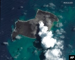 FILE - This satellite image provided by Maxar Technologies shows an overview of Hunga Tonga Hunga Ha'apai volcano in Tonga on Jan. 6, 2022, before a huge undersea volcanic eruption.