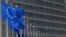 FILE - European Union flags set of half staff outside the European Commission headquarters in Brussels, Belgium.