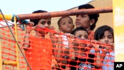 FILE - Sri Lankan refugees are seen onboard the Oceanic Viking, an Australian Customs and Fishery Patrol vessel about 14 kilometers out at sea from Kijang, Tanjung Pinang on the Indonesian Island of Bintan.