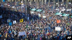 FILE - Thousands gather during a trade unions rally in downtown Ljubljana, Slovenia, Feb. 14, 2018. 