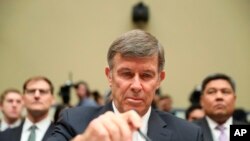 Acting Director of National Intelligence Joseph Maguire takes his seat before testifying before the House Intelligence Committee on Capitol Hill in Washington, Sept. 26, 2019.