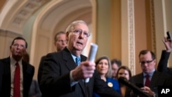 Senate Majority Leader Mitch McConnell, R-Ky., talks to reporters following a GOP strategy meeting at the Capitol in Washington.