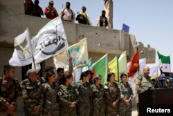 Syrian Democratic Forces (SDF) spokesman Talal Silo speaks during a news conference in Hukoumiya village in Raqqa, Syria, June 6, 2017.