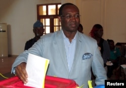 Central African Republic presidential candidate Anicet Dologuele casts his ballot at a polling center during the presidential election in Bangui, capital of the Central African Republic, Dec. 30, 2015.