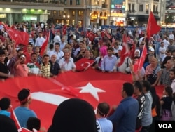 Supporters of Turkish President Recep Tayyip Erdogan have held nightly rallies since Friday's failed coup. At this rally Monday night, they called for Turkey to reinstate the death penalty as the government arrested thousands including soldiers, generals, judges and high-ranking officials. (L. Ramirez/VOA)