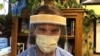 Dr. Gerry Gacioch wears a face shield made by temple volunteers at Rochester General Hospital, April 13, 2020. (Photo courtesy of Dinh Tran Tuan)