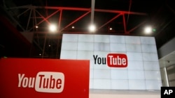 FILE - Signs inside the YouTube Space LA offices in Los Angeles, Oct. 21, 2015.