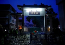 Ghost paper money usually tossed at funerals is left by protesters at the entrance to a village in Yuen Long district in Hong Kong, July 27, 2019.