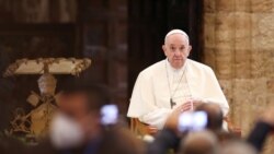 Pope Francis meets with people who have made a pilgrimage to the Assisi, during a private visit, ahead of World Day of the Poor, at Santa Maria degli Angeli basilica, in Assisi, Italy, Nov. 12, 2021.