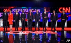 FILE - Republican presidential candidates, from left, John Kasich, Carly Fiorina, Marco Rubio, Ben Carson, Donald Trump, Ted Cruz, Jeb Bush, Chris Christie, and Rand Paul take the stage during the CNN Republican presidential debate at the Venetian Hotel & Casino