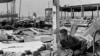 This Aug. 19, 1969 photograph showing Carl Wright, 11, drinking from a broken pipe amid the ruins of his father's service station in Gulfport, Miss., in the aftermath of Hurricane Camille.