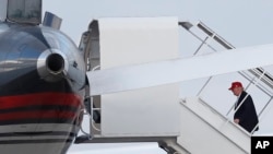 President-elect Donald Trump boards his plane at Palm Beach International Airport, Nov. 27, 2016.