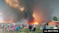 A fire is seen at a Balukhali refugee camp in Cox's Bazar, Bangladesh, March 22, 2021. (Courtesy of Rohingya Right Team/MD Arakani/Handout via Reuters)