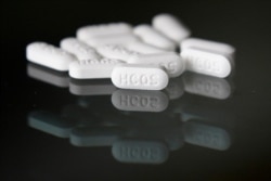 FILE - This April 6, 2020, photo shows an arrangement of hydroxychloroquine pills in Las Vegas.