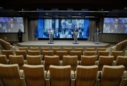 European Commission President Ursula von der Leyen, left, and European Council President Charles Michel address a media conference at an EU summit in Brussels, July 21, 2020.