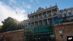 FILE - The sun sets behind the Palais Coburg, where nuclear talks were held in Vienna, Austria, on Aug. 5, 2022. The Western powers accused Tehran on Dec. 18, 2023, of developing and testing ballistic missiles, transferring hundreds of drones to Russia, and enriching uranium.