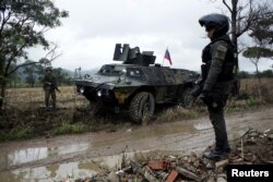 Colombian soldiers stand guard during a military operation at the border with Venezuela in Cucuta, Feb. 13, 2018.