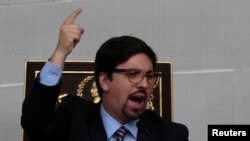 FILE - Freddy Guevara, first Vice-President of the National Assembly and lawmaker of the Venezuelan coalition of opposition parties (MUD), attends a session of Venezuela's opposition-controlled National Assembly in Caracas, Venezuela, Aug. 2, 2017. 