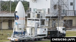 FILE - The European Space Agency's (ESA) Intermediate eXperimental Vehicle being transported ready for its launch atop a Vega rocket from Europe’s Spaceport in French Guiana, Jan. 30, 2015.