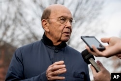 FILE - Commerce Secretary Wilbur Ross speaks to reporters outside the White House in Washington.