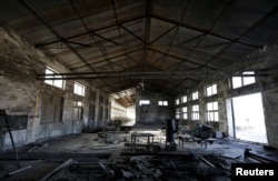 FILE - A closed brick factory building on the outskirts of Beijing, China, Jan. 18, 2016.