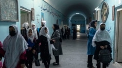 Afghan girls exit classrooms at Tajrobawai Girls High School, in Herat, Afghanistan, Nov. 25, 2021.