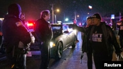 A protester shouts at police in Berkeley, Missouri, December 24, 2014.