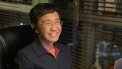 In this photo provided by the Rappler, Rappler CEO and Executive Editor Maria Ressa reacts after hearing she won the Nobel Peace Prize, inside her home in Taguig, Metro Manila, Philippines, Oct. 8, 2021.