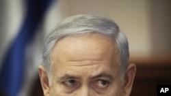 Israeli Prime Minister Benjamin Netanyahu talks during a weekly cabinet meeting in Jerusalem, Sunday, Sept. 18, 2011