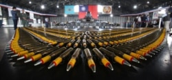 Bullets are lined up in front of a U.S. made F-16V fighters during a military exercise in Chiayi County, southern of Taiwan, Jan. 15, 2020.