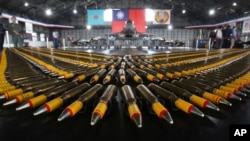 FILE - Bullets are lined up in front of a U.S.-made F-16V fighters during a military exercise in Chiayi County, southern Taiwan, Jan. 15, 2020. The U.S. has declassified cables on Taiwan arms sales as China ramps up pressures on Taipei.
