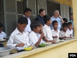 Students at a primary school in Kampong Thom province, Cambodia, receive breakfast as part of a World Food Program, 2014