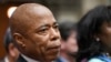 FILE - New York City Mayor Eric Adams listens to Gov. Kathy Hochul deliver her State of the State address in the Assembly Chamber at the state Capitol on Jan. 10, 2023, in Albany, New York. 