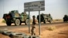 FILE - French armored vehicles head toward the Niger border before making a left turn north in Gao, northern Mali.
