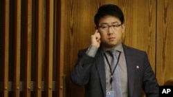 FILE - Kim Ju Song, a member of the North Korean delegation, listens to a panel discussion about human rights abuses in North Korea at U.N. headquarters in New York, Oct. 22, 2014.