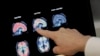 A doctor looks at PET brain scans at Banner Alzheimers Institute in Phoenix on Aug. 14, 2018. (AP Photo/Matt York, File)