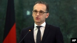 German Foreign Minister Heiko Maas, speaks during a press conference with Afghanistan's Foreign Minister Salahuddin Rabbani, in Kabul, Afghanistan, March 11, 2019. 