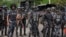 FILE - Police officers stand guard in Lagos, Nigeria, Aug. 9, 2024. Nigerian police said 20 medical students, a doctor and six other captives were rescued from their captors unharmed in central Benue State on Aug. 23.