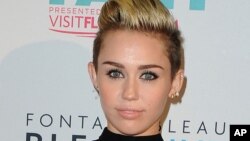 Miley Cyrus arrives at the iHeartRadio Ultimate Pool Party at the Fontainebleau Hotel on June 29, 2013 in Miami.