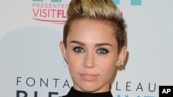 Miley Cyrus arrives at the iHeartRadio Ultimate Pool Party at the Fontainebleau Hotel on June 29, 2013 in Miami.