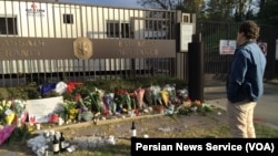A memorial to victims of the coordinated terrorist attacks in Paris Friday grows outside the French Embassy in Washington, D.C., Nov. 14, 2015.